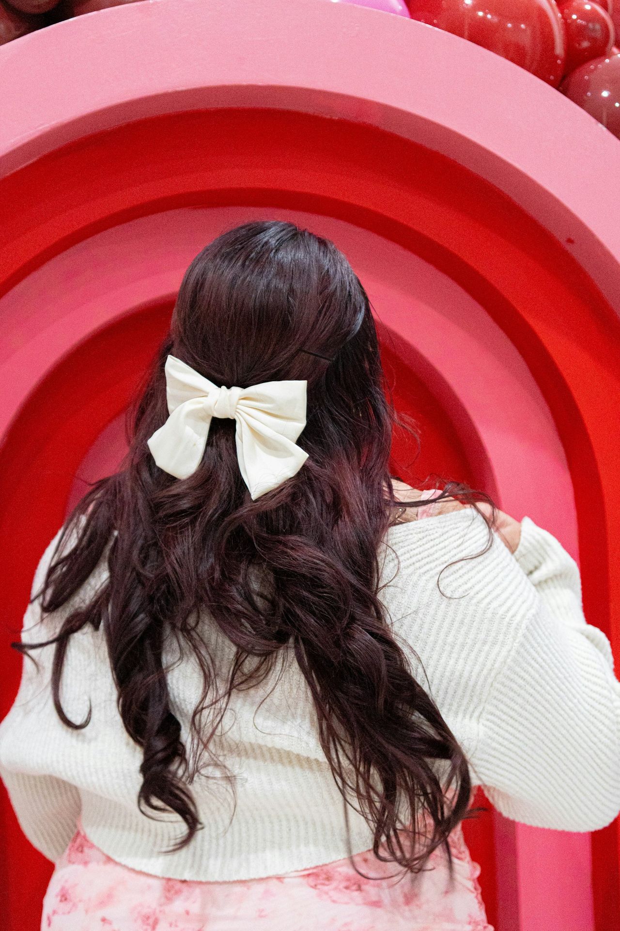 A woman with a bow in her hair
